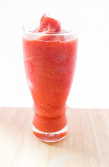 A glass of strawberry smoothie