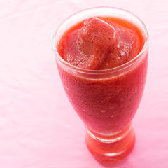 A glass of strawberry smoothie
