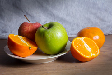 Still life combination fruits,green and red apple with orange