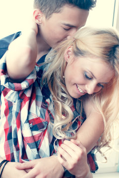 fashion portrait of young sensual couple. love and kiss
