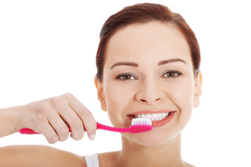 Young beautiful woman with toothbrush and paste.