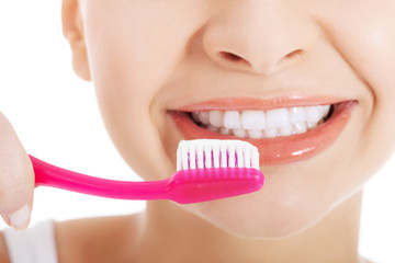 Young beautiful woman with toothbrush and paste.