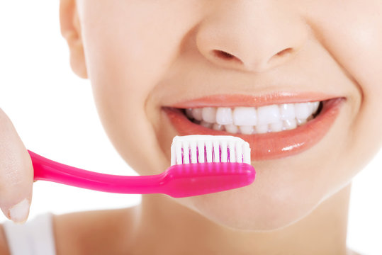 Young beautiful woman with toothbrush and paste.