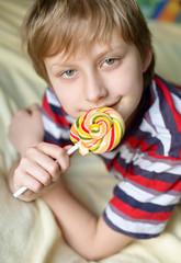 boy eating lollipop