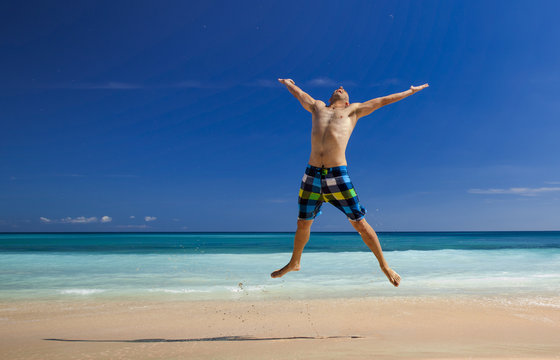 Man Jumping On The Beach