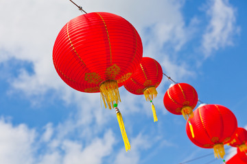 Red Chinese Paper Lanterns against a Blue Sky © dvoevnore