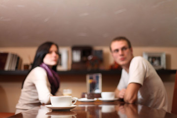 young lovers man and woman talking in the cafe