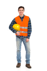 Smiling construction worker with helmet under the arm.