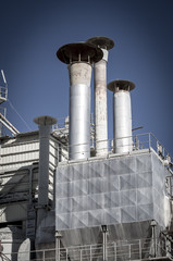 Obraz premium Metal refinery, pipelines and towers, heavy industry overview