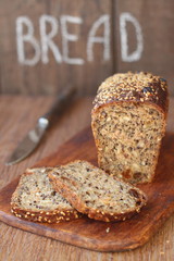 loaf of bread cut into slices on a board