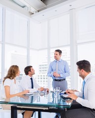 Fototapeta premium Executives sitting around conference table
