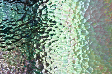 Textured glass panel with strong highlights and deep shadows