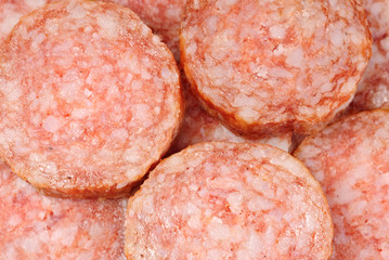 sliced sausage as food background