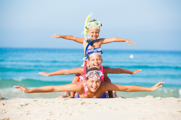 three happy children on beach...