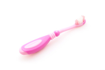 pink toothbrush for child on white background