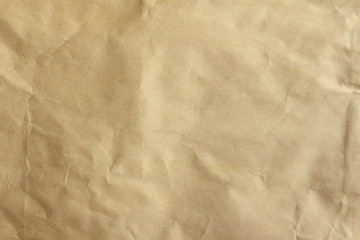 Crumpled brown paper texured background
