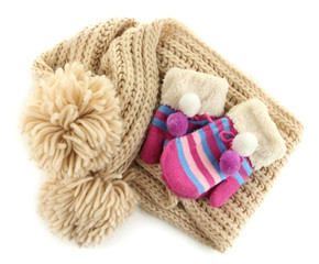 Striped mittens with scarf isolated on white