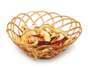 Basket with dried apples on white background