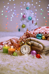 Composition with plaids, candles and Christmas decorations,