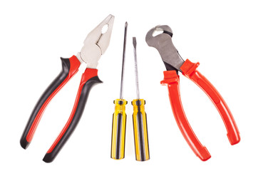 Pliers, screwdrivers and nippers on a white background
