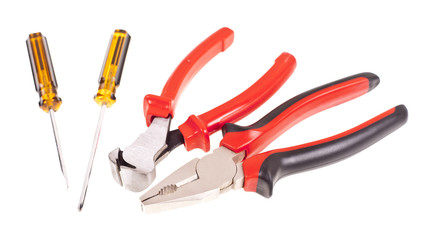 Pliers, screwdrivers and nippers on a white background