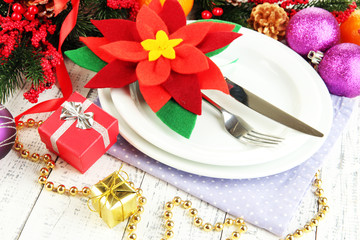 Christmas table setting with festive decorations close up