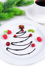 Christmas tree from chocolate on plate close-up