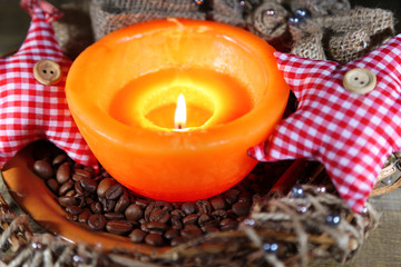 Burning candle with Christmas decorations
