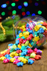 Paper stars with dreams on table on dark background