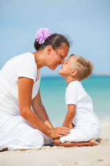 Mother and son having fun on the beach