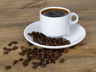 Fototapeta na wymiar warm cup of coffee on brown background