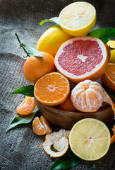 Fresh citrus fruits on rustic background