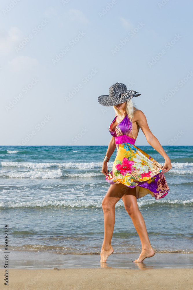 Wall mural woman on the beach