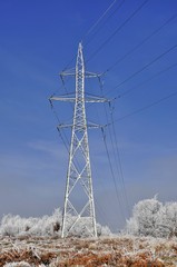 High voltage power lines and blue sky