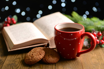 Composition of book with cup of coffee and Christmas