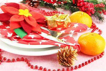 Christmas table setting with festive decorations close up