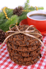 Sweet cookies with cup of tea on table close-up
