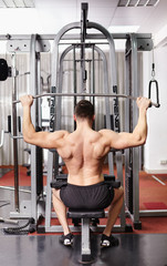 Fototapeta premium Athletic man pulling heavy weights