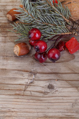  traditional holly Christmas tree on a wooden background