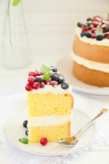 Sponge cake with whipped cream and fresh berries.