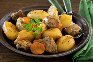 Roast pork and potatoes with spices.