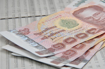 Thousand baht notes on stock quotes
