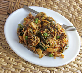 Vegan vegetable rice dish with fork