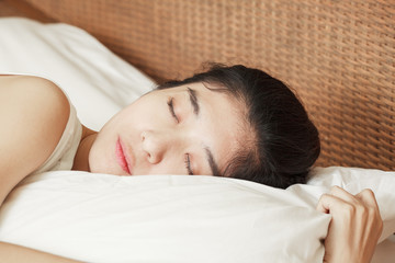 young beautiful woman sleeping in bed