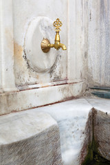 old faucet in marble