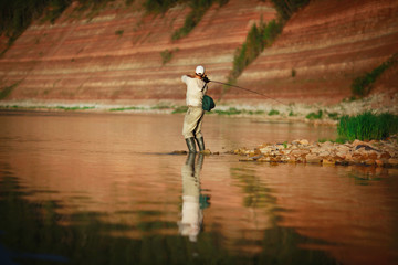 Naklejka premium young man on a fishing trip