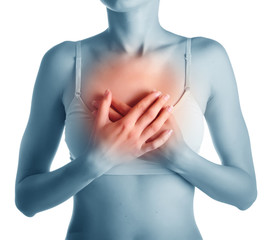 woman having heart attack holding her chest