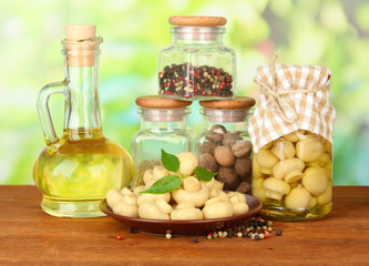 Composition of delicious marinated mushrooms, oil and spices