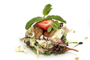 salad of meat and greens adorned with strawberries