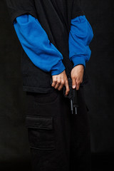 Teenage gangster holding gun